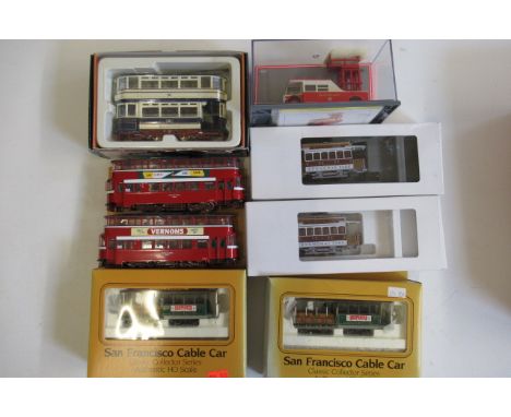 Eight tram models by various manufacturers including AEC tower wagon, Bachmann San Francisco cable car and two OO Gauge worki