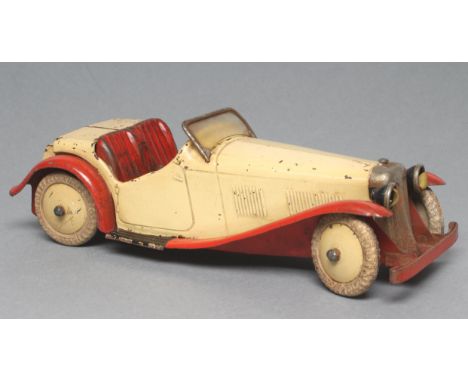 Meccano clockwork sports car finished in red and cream, some damage, body work rusting, F-P (Est. plus 21% premium inc. VAT)