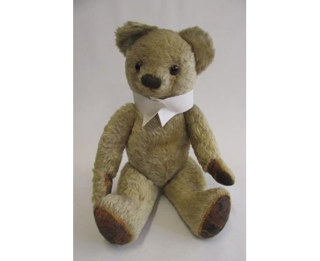 A Chad Valley teddy, c.1940, with rotating joints, amber button eyes and dress collar, 22" high (Est. plus 21% premium inc. V