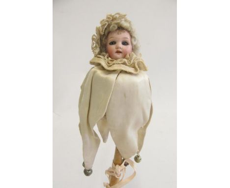 A Schoenau &amp; Hoffmeister bisque head Marotte doll with blue glass eyes, open mouth with four top teeth, blonde mohair wig