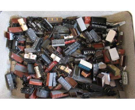 A large quantity of playworn goods wagons by Hornby, Bachmann and others, some items damaged, others good (Est. plus 21% prem