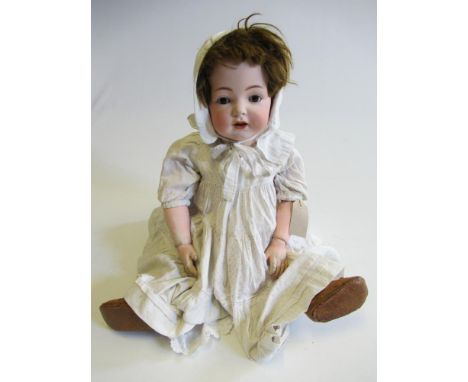 Kammer &amp; Reinhardt bisque socket head character doll, with brown glass sleeping eyes, open mouth with two top teeth and t