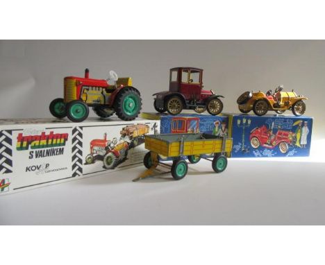 Modern issue clockwork tin vehicles comprising tractor and trailer, Shucho Mercer race car, Schuco Ford T Coupe, all items bo