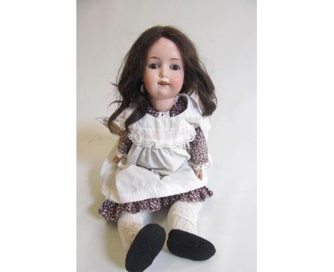 A William Goebel bisque socket head doll, with brown glass sleeping eyes, open mouth with five top teeth, later brown wig, jo