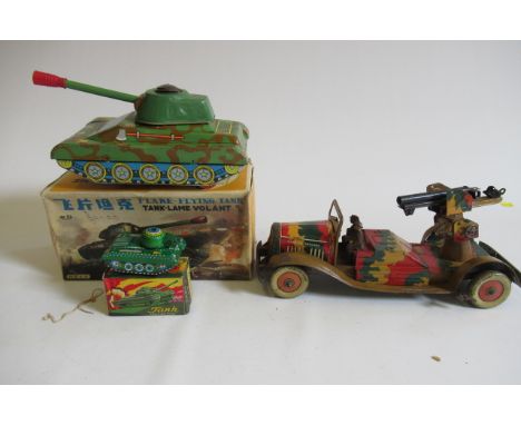 Battery powered tinplate tank with Gyro Action, boxed, a small friction tank and a Mettoy clockwork army gun, G-P (Est. plus 