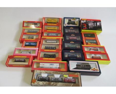 Twenty seven goods wagons by Hornby and Bachmann including coal trucks, oil tankers, box vans, all items boxed, E-M (Est. plu