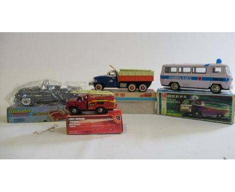 Four friction powered vehicles comprising ten wheel truck, fire engine, ambulance and open top car, all items boxed, G-E (Est