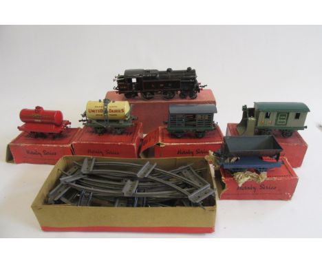 Hornby clockwork No2 Tank finished in L.M.S. black, in repaired box, 6781 to sides, some paint damage, F, five goods trucks c