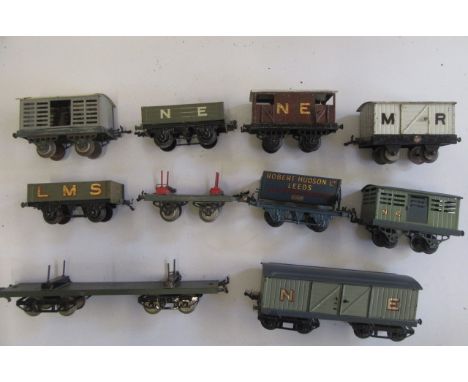 Ten Hornby Goods rolling stock including tipping truck, milk van, N.E. Bigie van and N.E. brake van, some overpainting, paint