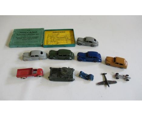 Ten early Dinky vehicles including Oldsmobile, Packard, Peugeot and Tank, and an empty box for Meccano electric lighting set,