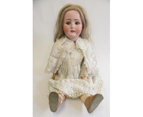 A Catterfelder Puppenfabrik bisque socket head doll with blue glass sleeping eyes, open mouth with four top teeth, pierced ea