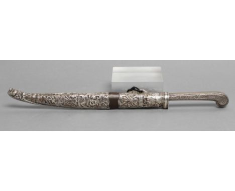 AN INDIAN DAGGER, with 6 1/2" blade, floral decorated grip and white metal embossed sheath depicting a flag ship, St. George 
