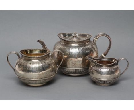 A MID VICTORIAN SILVER THREE PIECE TEA SERVICE, maker Robert Harper, London 1873, of semi-reeded globular form with chased ac