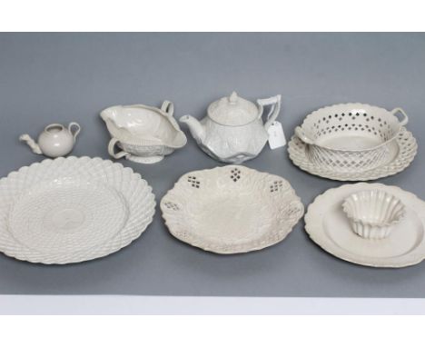 A COLLECTION OF STAFFORDSHIRE WHITE SALTGLAZE STONEWARE, 18th century, comprising an oval pecten shell moulded double lipped 