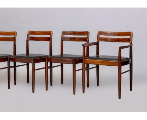 H.W.KLEIN FOR BRAMIN- A ROSEWOOD DINING TABLE AND CHAIRS, the extending oblong table with folding leaves raised on four turne