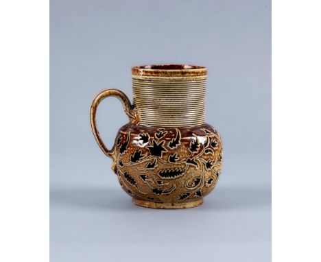 A NOTTINGHAM BROWN SALTGLAZE STONEWARE SMALL JUG, c.1720, of baluster form with engine turned cylindrical shoulders, the tape