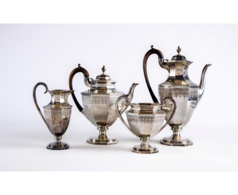 A LATE VICTORIAN SILVER FOUR PIECE TEA AND COFFEE SERVICE, maker Aldwinkle & Slater, London 1888, of hexagonal vase form with