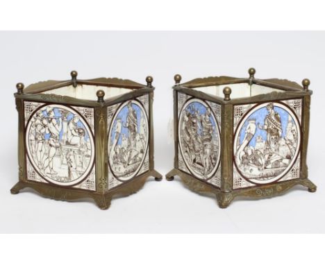 A PAIR OF AESTHETIC MOVEMENT MINTON TILE CACHE-POTS, printed in underglaze brown and overpainted in blue with scenes from the