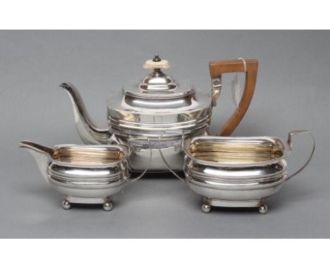 A LATE GEORGE III SILVER TEAPOT, maker Peter and William Bateman, London 1811, of rounded oblong form with fluted angles and 