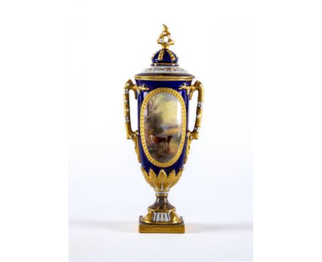 A ROYAL WORCESTER CHINA SMALL URN AND COVER, 1912, of plain U form with two flower moulded angular handles on waisted socle a