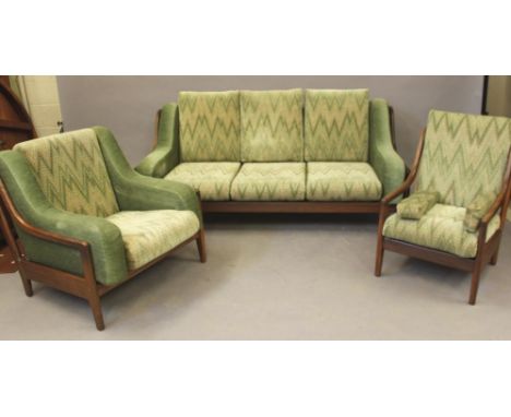 A FORMOSA TEAK LOUNGE SUITE, 1960's, comprising three seater settee, the slatted back with straight top rail, down curved ope