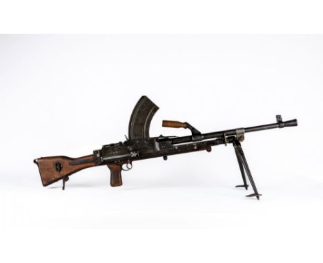 A DEACTIVATED INGLIS BREN MK.II NO.5 .303 LIGHT MACHINE GUN, with wooden carrying handle, removable magazine, adjustable rear