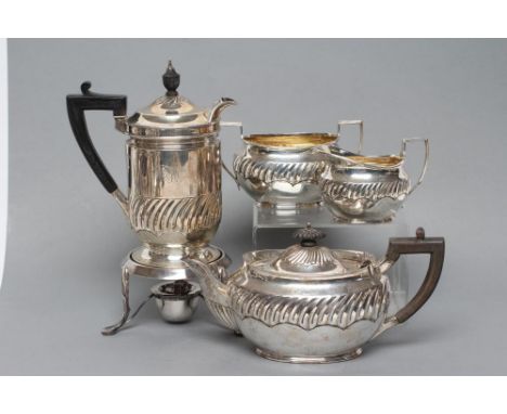 A LATE VICTORIAN SILVER FOUR PIECE TEA SERVICE, maker possibly Henry Stratford, Sheffield 1893, of semi-wrythen oval form, co