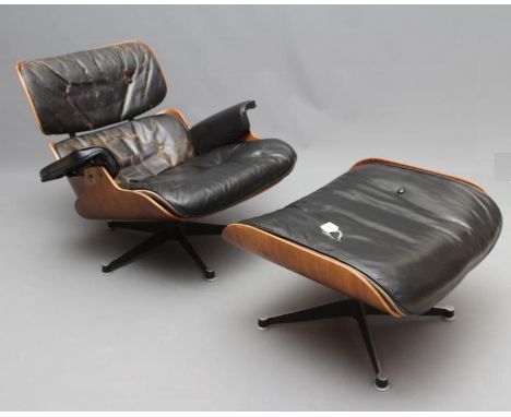 A CHARLES AND RAY EAMES HERMAN MILLER LOUNGE AND OTTOMAN, Model Nos. 670 and 671, 1970's, in Santas Palisander plywood, leath