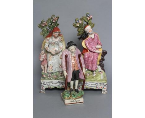 A PAIR OF OBADIAH SHERRATT TYPE PEARLWARE FIGURES, c.1810, modelled as "Elijah &" (sic) and "Widow", both raised upon faux ma