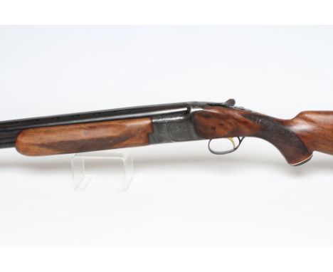A MIROKU OVER & UNDER 12 BORE SHOTGUN, with 26" barrel, fixed choke, ventilated top rib, ejectors, manual safety, single trig