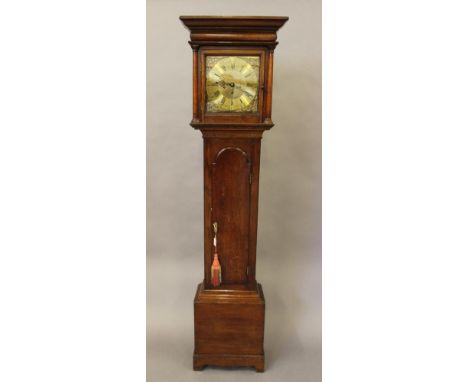 AN OAK LONGCASE signed William Boot, Sutton, the eight day movement with anchor escapement striking on a bell, 11" square bra