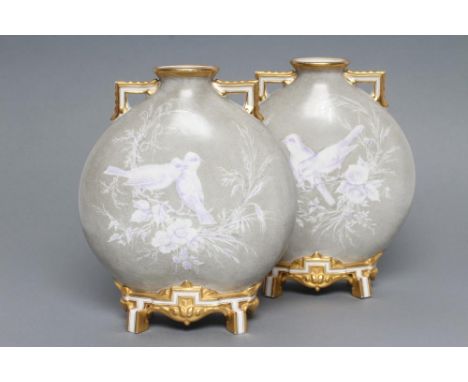A PAIR OF ROYAL WORCESTER PORCELAIN AESTHETIC MOON FLASKS, c.1880, with angular handles, raised upon key moulded bracket feet