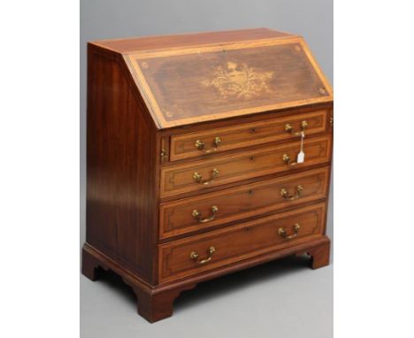 A MAHOGANY AND SATINWOOD BANDED BUREAU by Edwards & Roberts, with chequer stringing, the fallfront inlaid with an urn and cor