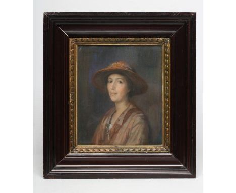 DONALD WOOD (1899-1953), Portrait of a Young Woman in a Brown Hat, half length, pastel, signed and dated 1923, 13 1/2" x 11 1