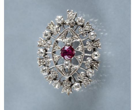 AN EDWARDIAN DIAMOND BAR BROOCH centred by a square panel pave set with four small stones and two points to a plain bar, stam