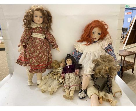 Box of various vintage porcelain headed and composition dolls