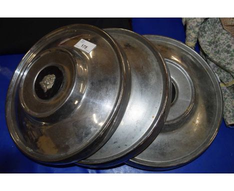 Four vintage Jaguar hub caps