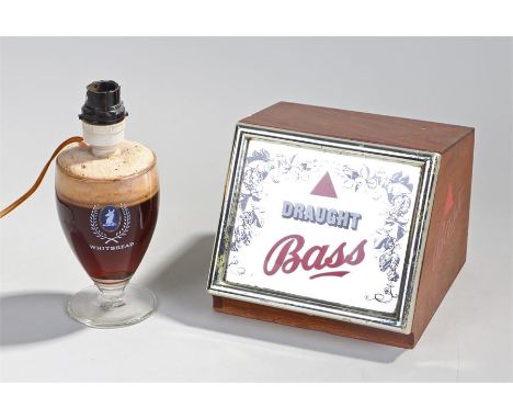 Breweriana, to include a Draught Bass advertising mirror light and a Whitbread glass lamp, (2)