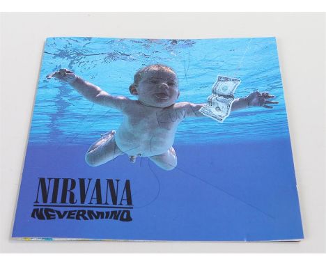 Nirvana, Nevermind CD, signed Kurt, Krist, Dave. GED 24425.  DGCD 24425