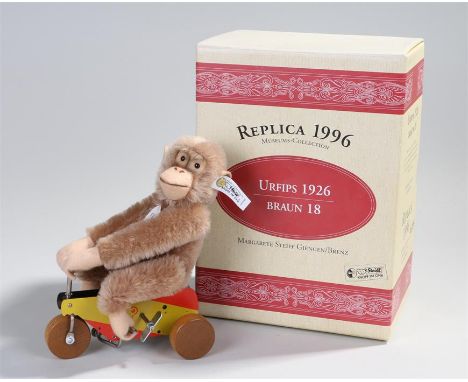 Steiff stuffed toy, Museums Collecting Urfips 1926, of a monkey on a bike, replica, boxed 