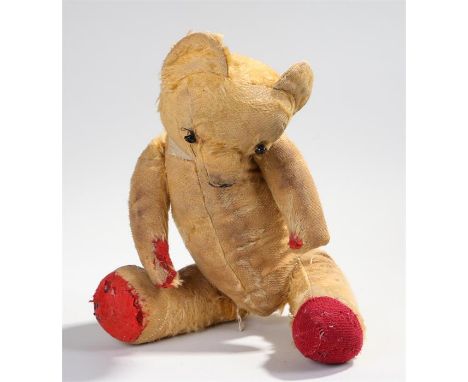 Early 20th Century teddy bear, with black button eyes. 46cm long