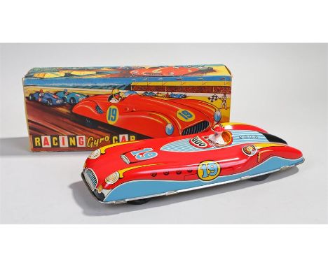 Wells Brimtoy Racing Gyro Car, no 139, the car in red with a race driver, number 19, boxed