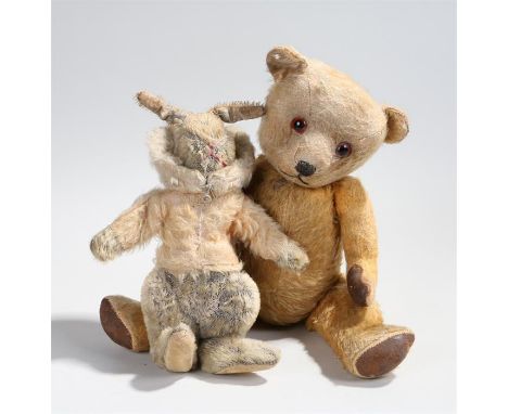 Stuffed toys, to include a teddy bear with orange and black eyes and a rabbit, (2)