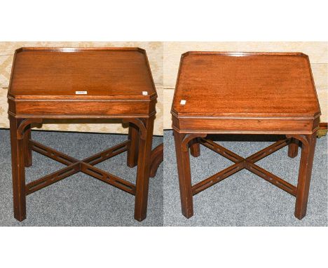 A pair of mahogany dish topped lamp tables, with canted corners, square supports, and X framed cross stretchers, 51cm by 42cm