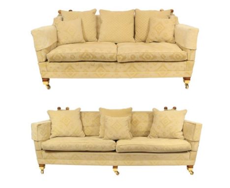 A Duresta four-seater upholstered sofa, 225cm by 110cm by 88cm together with a matching three-seater, both with scatter cushi