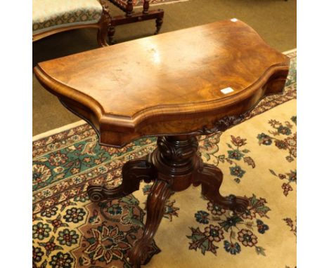 A Victorian walnut veneered card table, 91cm by 45cm by 74cm 