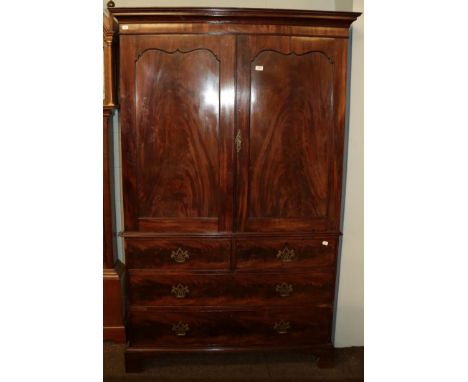 A 19th century mahogany linen press, raised over a three-height chest base on bracket feet, 120cm by 52cm by 202cm