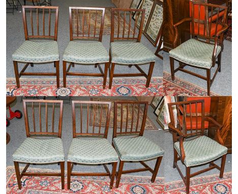 A set of eight George III mahogany stick back dining chairs, including a pair of carver armchairs 