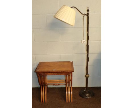 A 20th century nest of three pollard oak tables, crossbanded and raised on x-framed supports, largest 56cm by 40cm by 58cm to