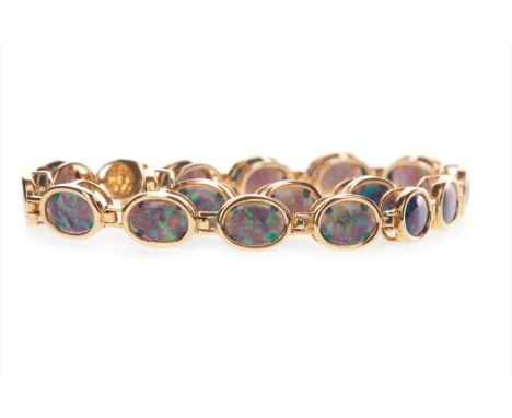 OPAL BRACELET, formed by collet set opals, 18cm long, in nine carat gold, 5.4g Please read the content of the ‘Important Info